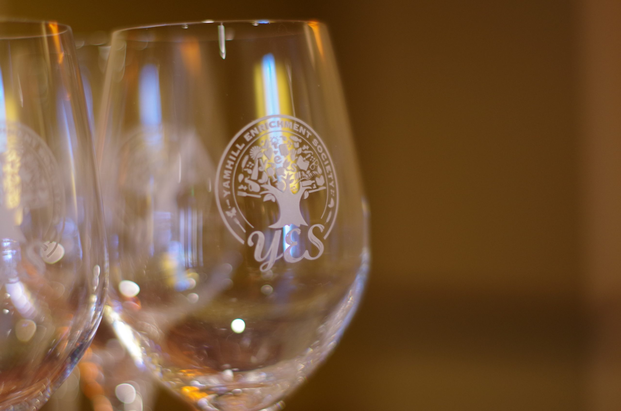Wine glasses with Yamhill Enrichment Society - YES logo on them